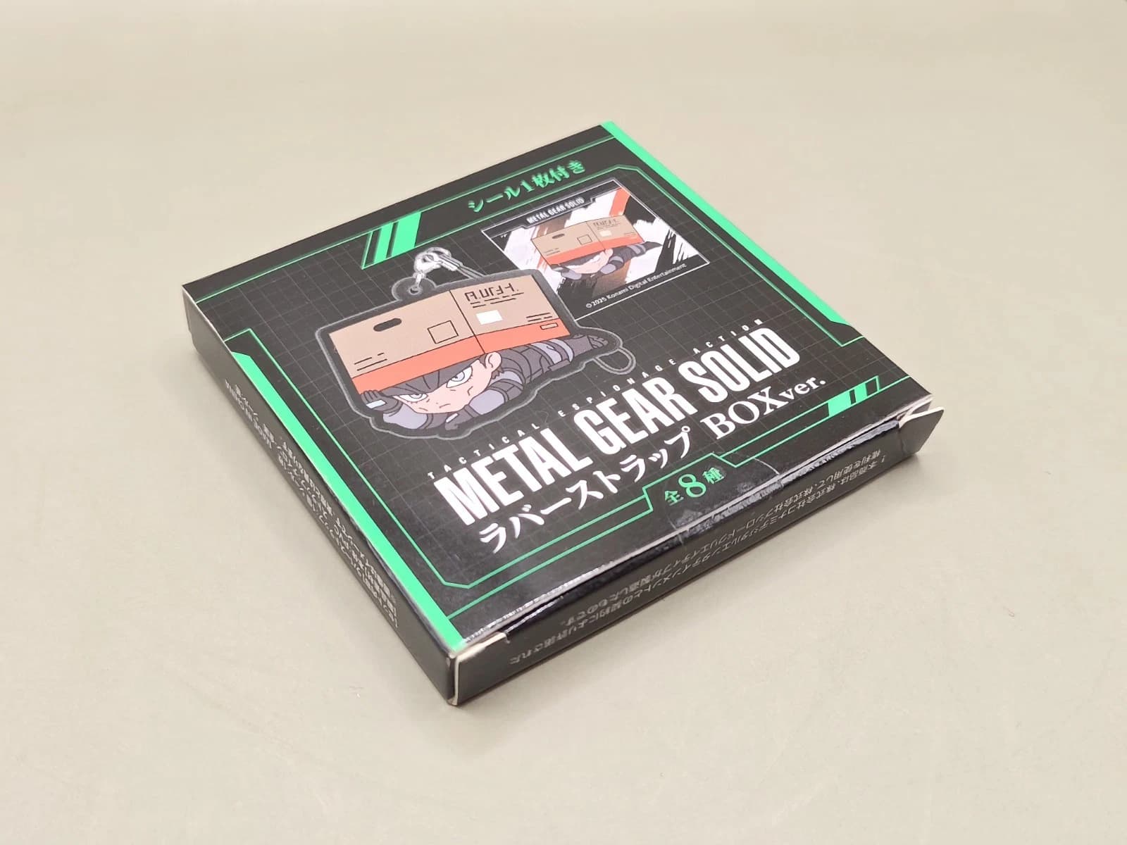 Metal Gear Solid Naked Snake Rubber Strap Keychain & Sticker Bushiroad — image 2