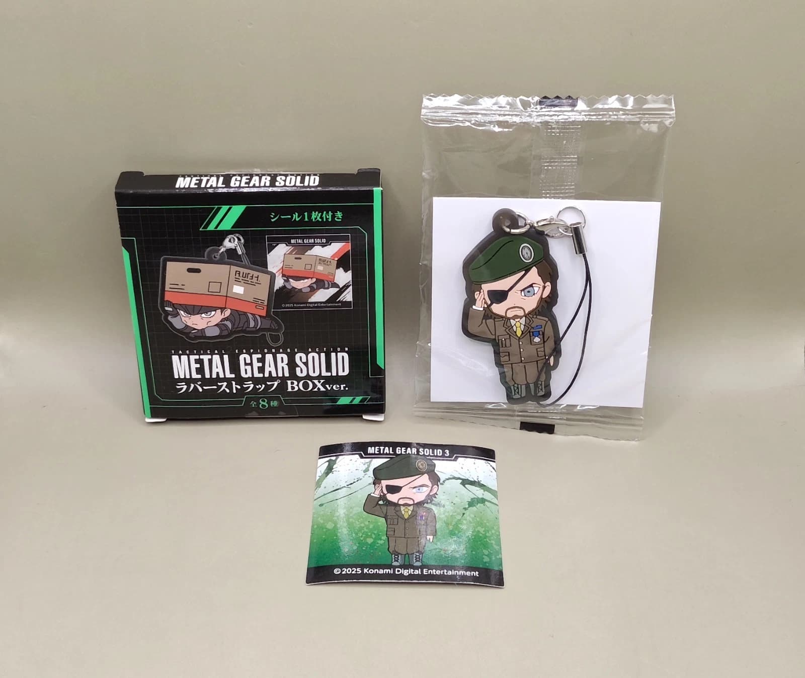 Metal Gear Solid Naked Snake Rubber Strap Keychain & Sticker Bushiroad — image 1